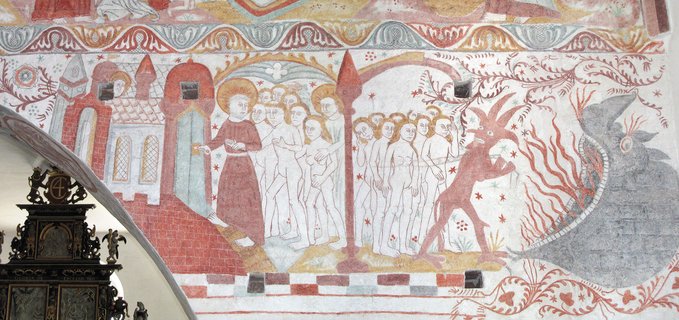 The devil leads sinful souls to Hell, while a monk or saint leads the pure to the gates of Heaven